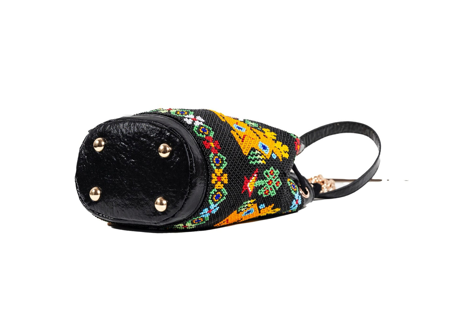 Bottom view of Vegan banana fiber bucket bag with Gujarati Dal Moti beadwork, sustainable Indian luxury accessory.