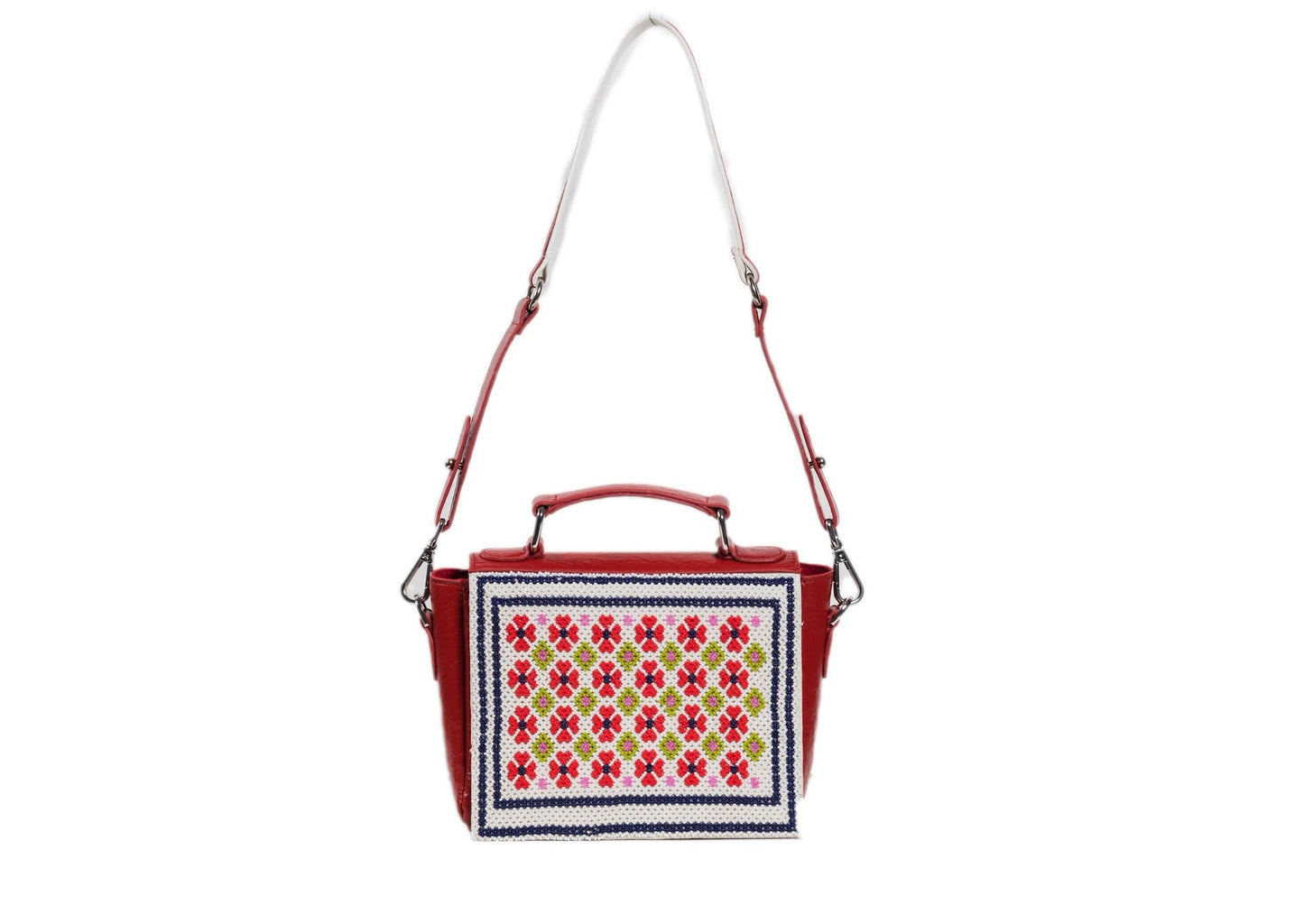 Strap fully extended for symmetrical Czech glass bead flowers on a bright red handbag, authentic Gujarati dal-moti craft.