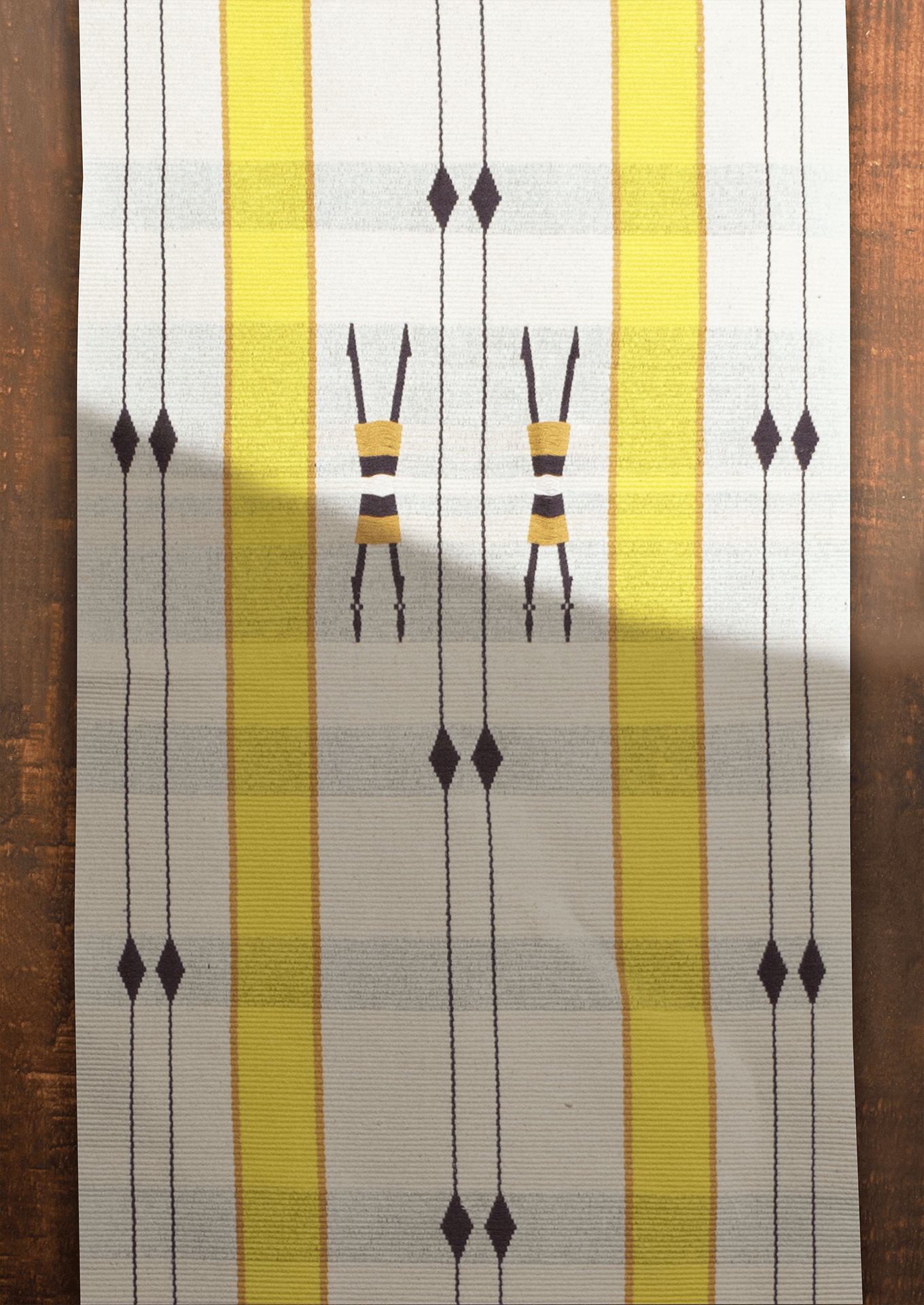 Handwoven cotton Mechu table runner with yellow stripes and tribal motifs, premium Naga textile art.