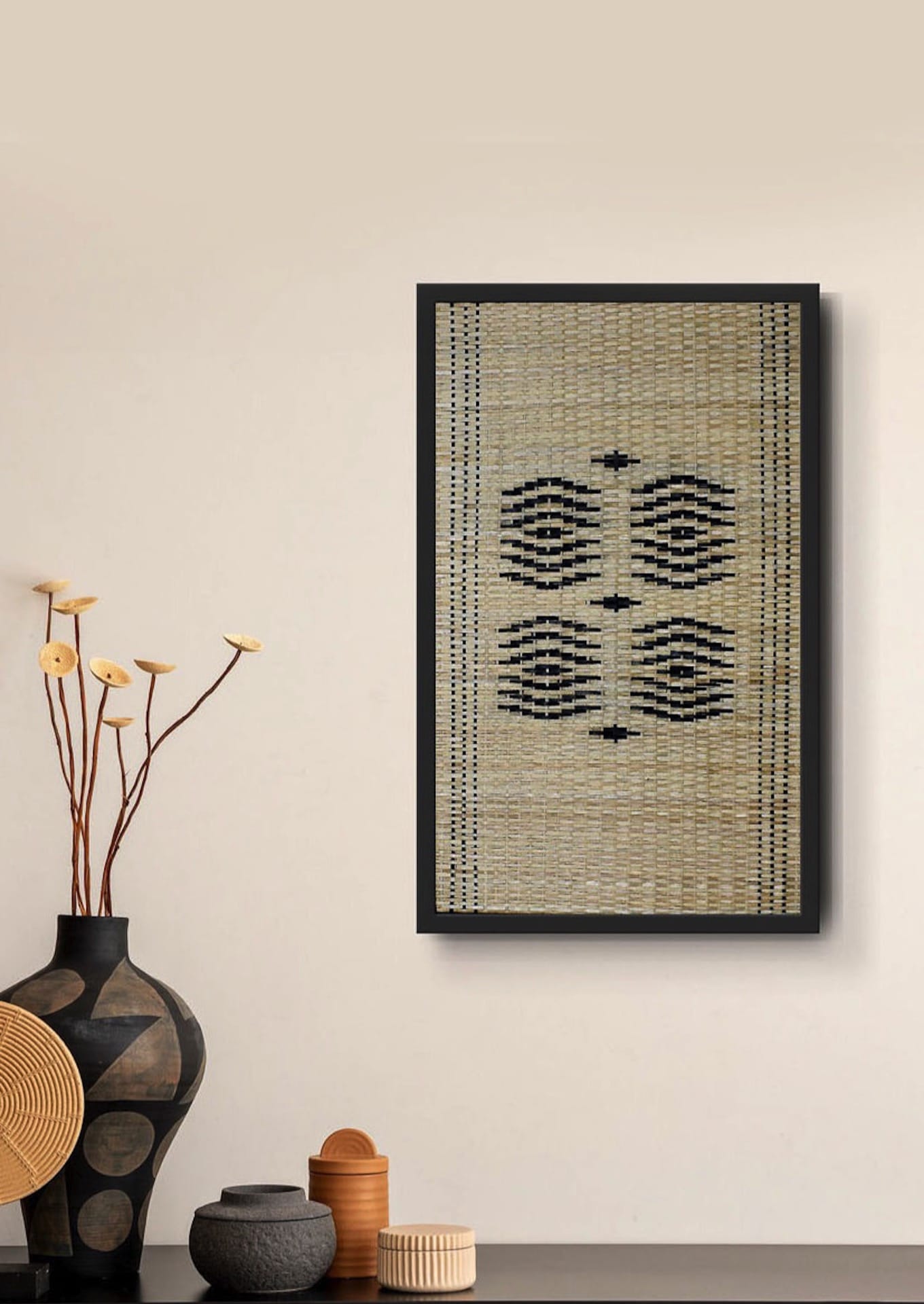 Intricate woven bamboo textile art displayed above a vase, premium Indian handicraft heritage.