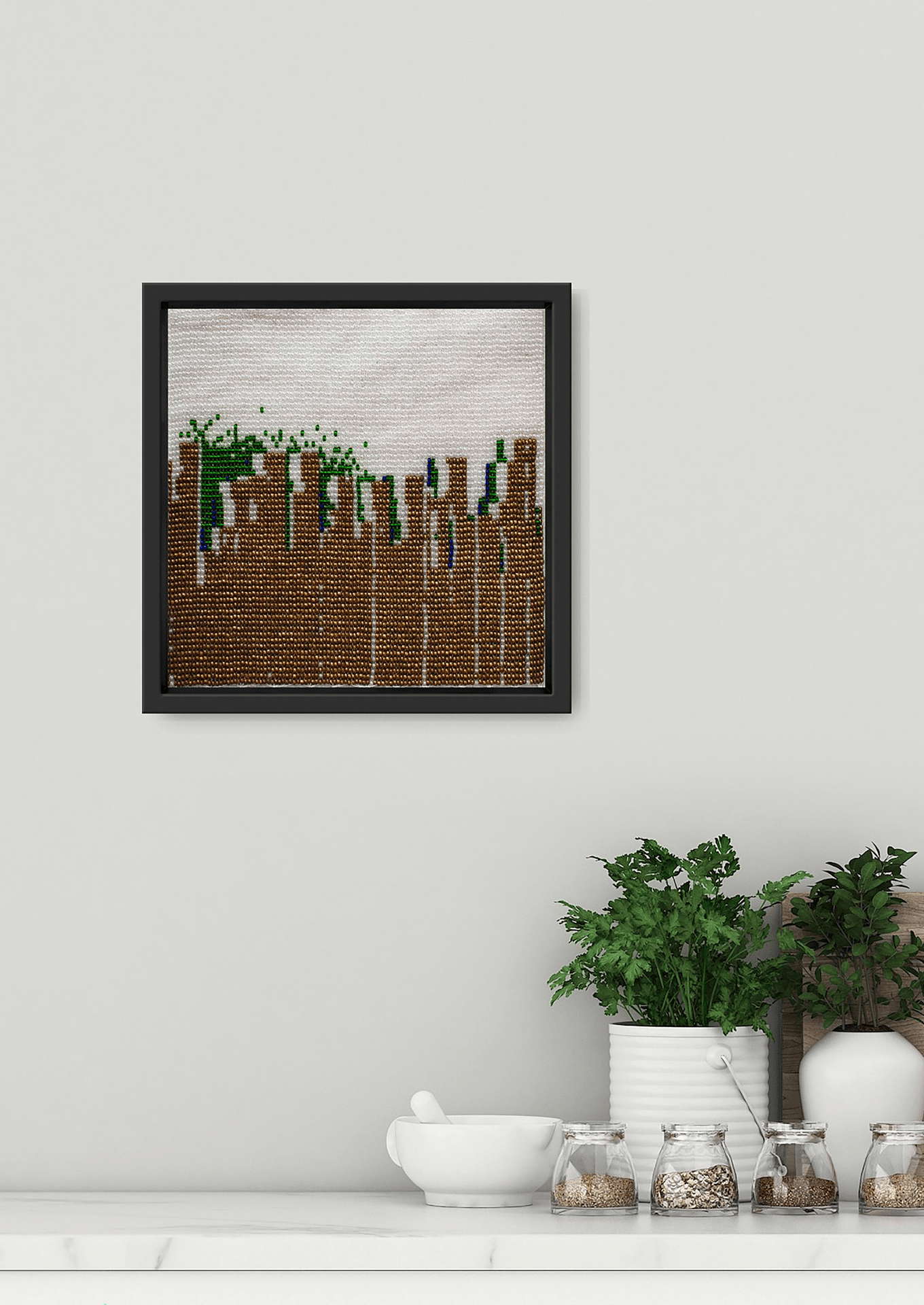 Framed vertical green and brown glass bead artwork, skyscraper silhouette Gujarati beadwork wall decor.