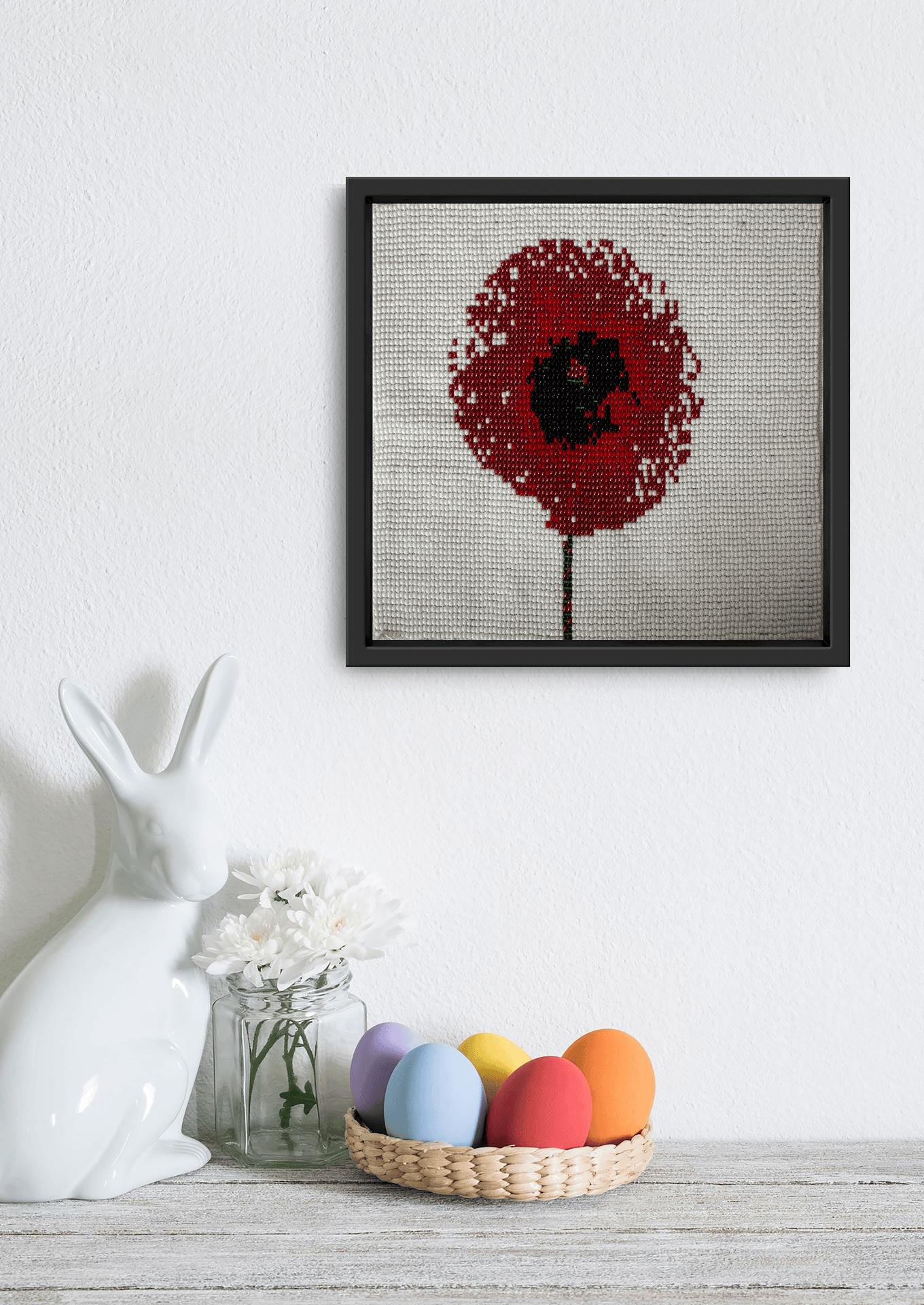 Soft hue glass bead-loom blossom styled next to a white ceramic piece, luxury Indian home decor.