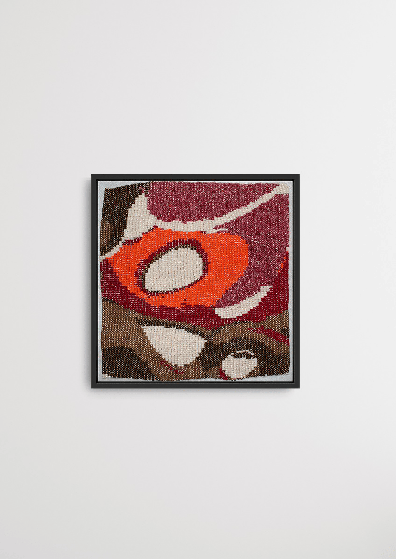 Framed red and brown organic circular glass bead artwork, handwoven Gujarati heirloom decor.