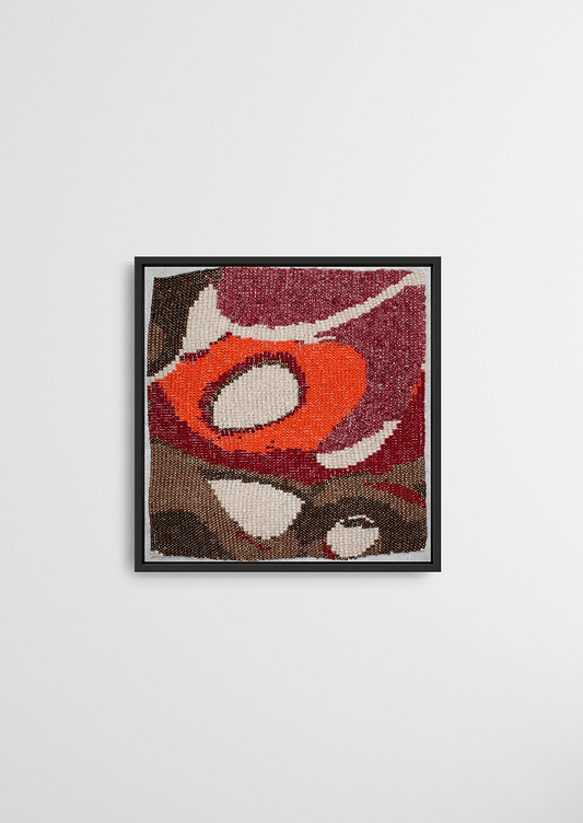 Framed red and brown organic circular glass bead artwork, handwoven Gujarati heirloom decor.