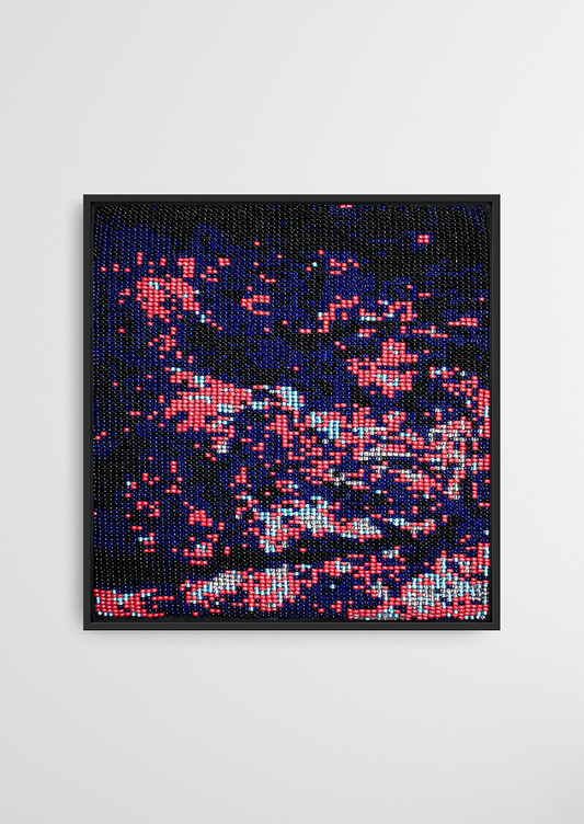 Framed dark background with dispersed pink glass bead artwork, traditional Gujarati handicraft wall decor.