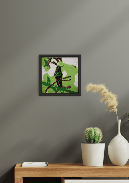 Hand-stitched forest bird glass bead-loom artwork on a grey wall, authentic Indian room art.