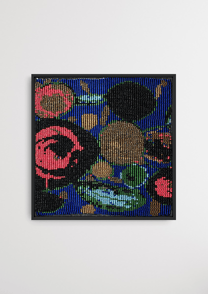 Framed multi-colored circular fluid glass bead artwork, traditional Gujarati bead-loom wall art.