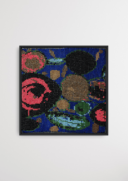 Framed multi-colored circular fluid glass bead artwork, traditional Gujarati bead-loom wall art.