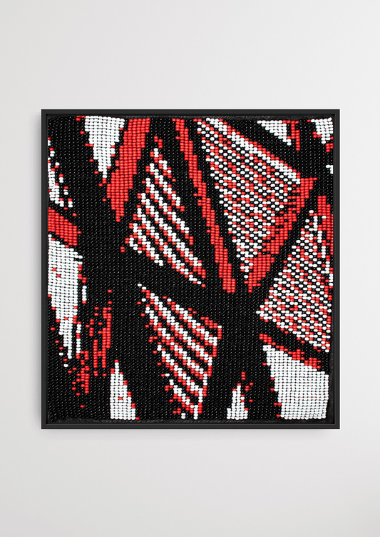 Handwoven abstract art piece with red, black, and white patterns from Gujarat.