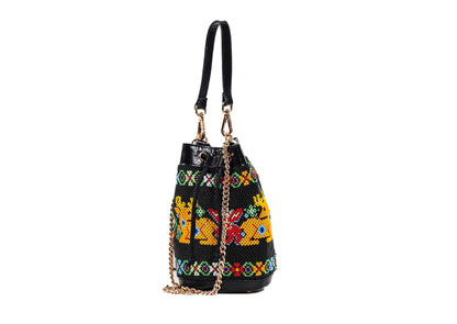 Side view of Vegan banana fiber bucket bag with Gujarati Dal Moti beadwork, sustainable Indian luxury accessory.