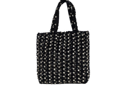 Black compact evening purse with a striking silver beaded burst pattern, handcrafted Indian artisanal accessory.