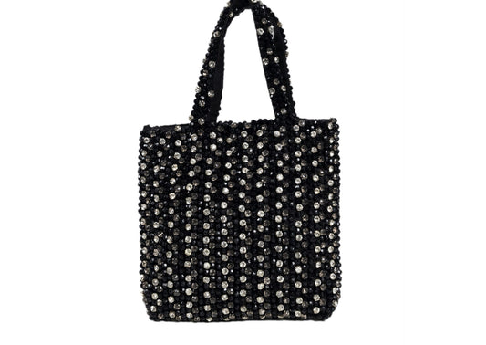 Black compact evening purse with a striking silver beaded burst pattern, handcrafted Indian artisanal accessory.