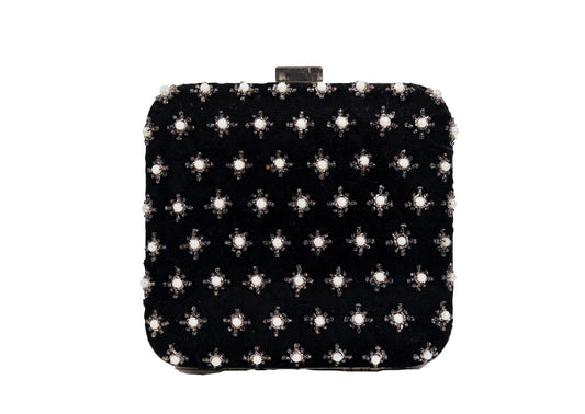 Black fabric evening clutch with metallic star beadwork, handcrafted premium Indian accessory.
