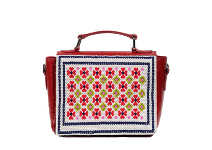 Vibrant red structured purse with delicate floral beadwork, premium Indian handcrafted accessory.