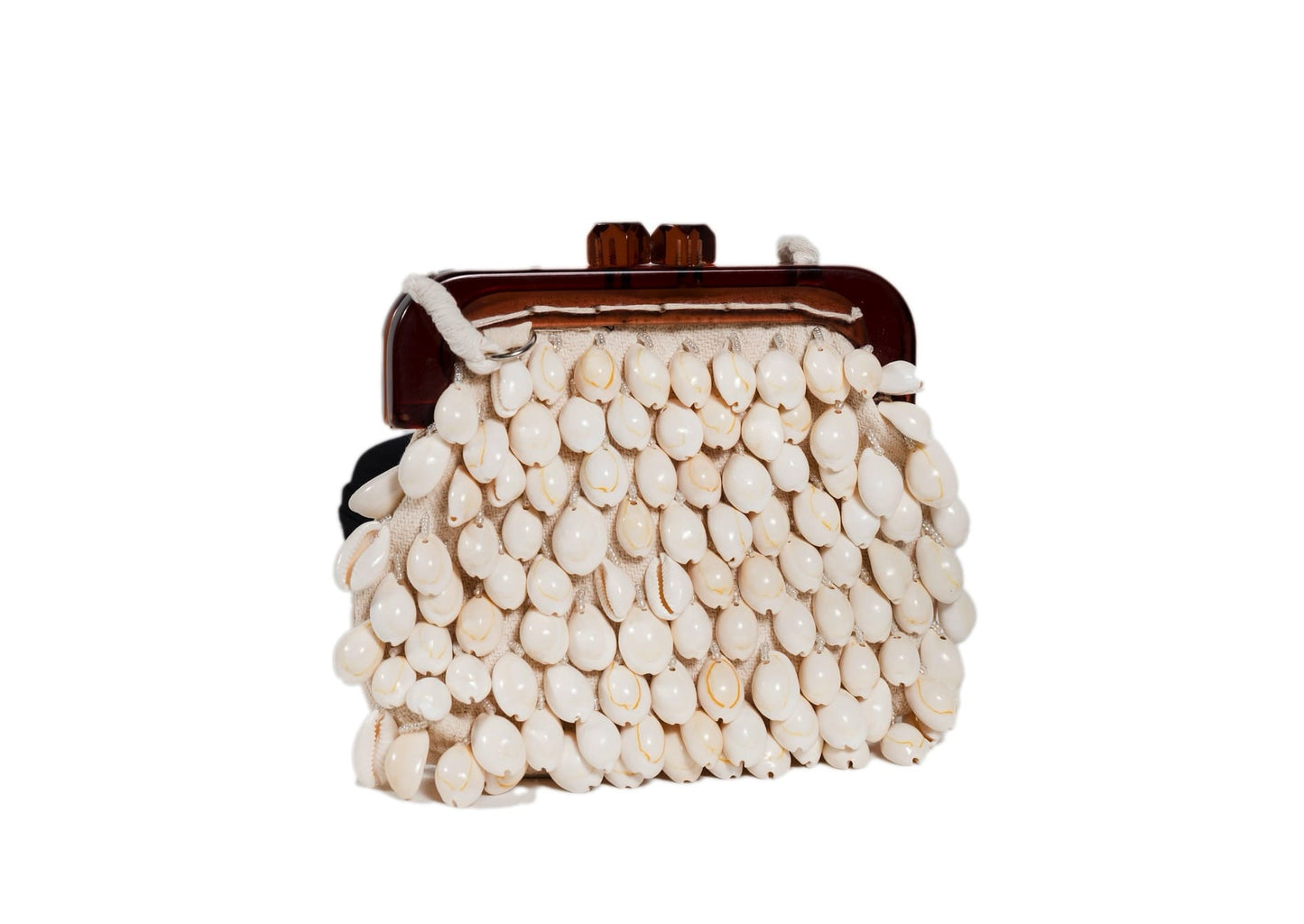 Diagonal view of ivory mother-of-pearl shell beaded day bag, handcrafted premium Indian luxury accessory.