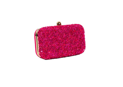 Another angle of vibrant fuchsia pink beaded evening clutch, handcrafted premium Indian luxury accessory.