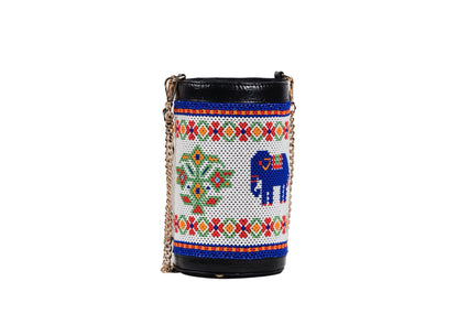 Traditional Saurashtra elephant beadwork on a cylindrical bag with a vegan leather strap.