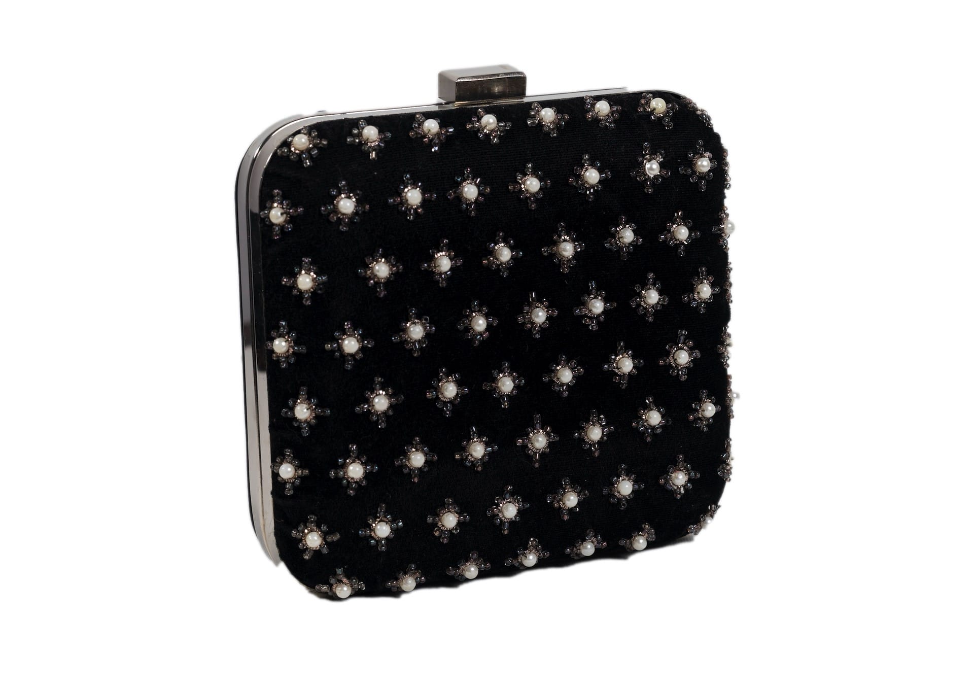 Diagonal view of black fabric evening clutch with metallic star beadwork, handcrafted premium Indian accessory.