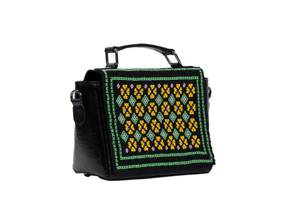 Diagonal view of vegan banana leather purse with yellow and green diamond beadwork, premium Indian accessory.