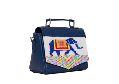 Diagonal view of Navy blue leather purse with traditional elephant beadwork, handcrafted premium Indian accessory.