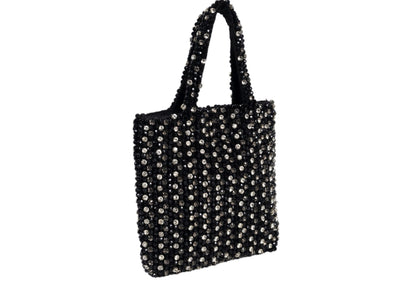 Black compact evening purse with a striking silver beaded burst pattern, handcrafted Indian artisanal accessory.