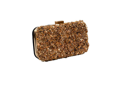 Diagonal view of golden beaded minimalist evening clutch, handcrafted premium Indian luxury accessory.