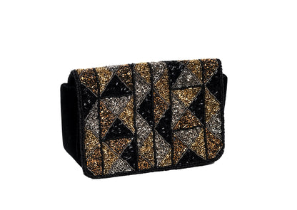 Diagonal view of geometric gold and silver beaded evening purse, handcrafted premium Indian luxury accessory.