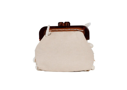 Rear view of sophisticated scalloped pattern of luminous shell discs, authentic artisan handbag.