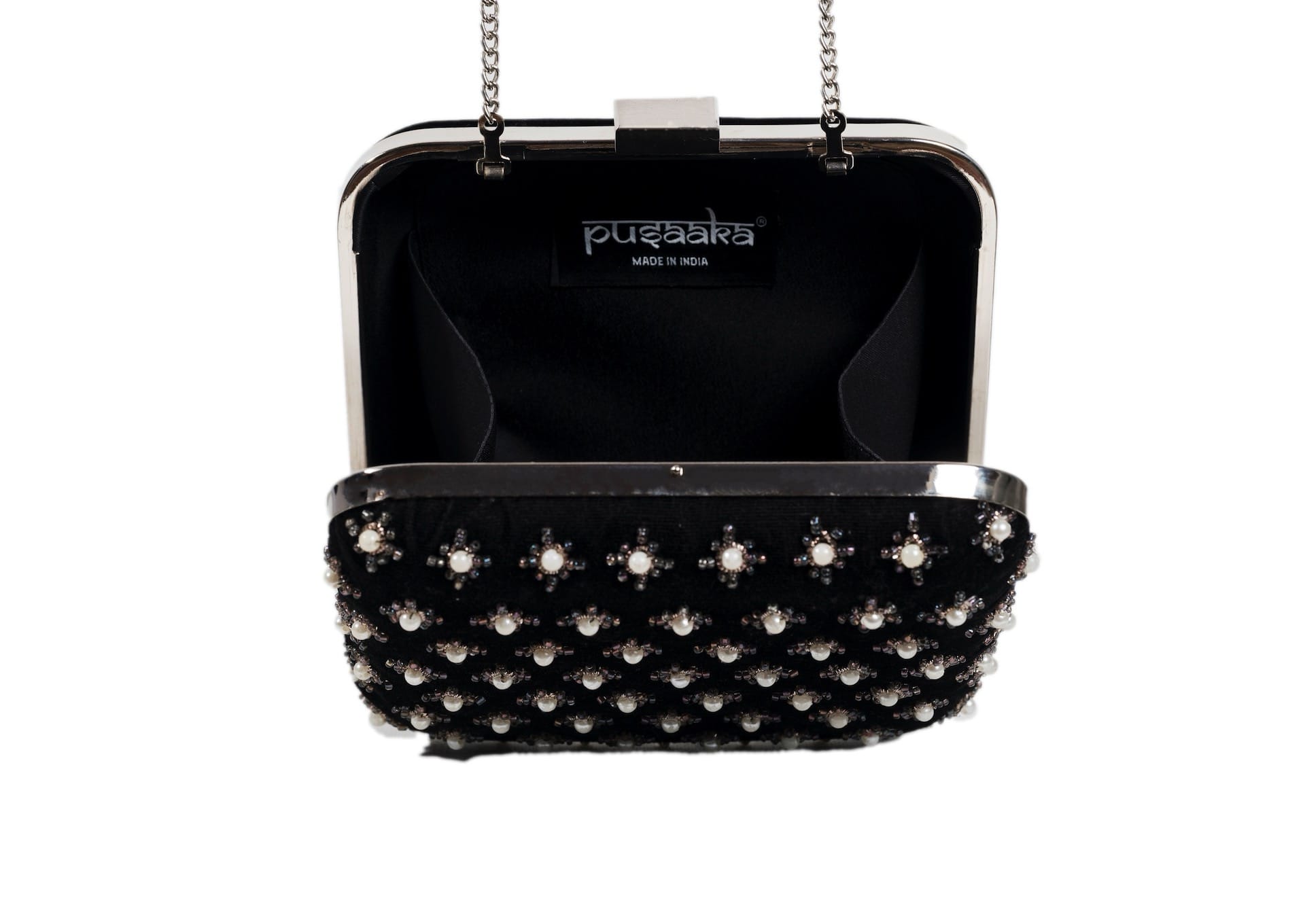 Inside view of black fabric evening clutch with metallic star beadwork, handcrafted premium Indian accessory.