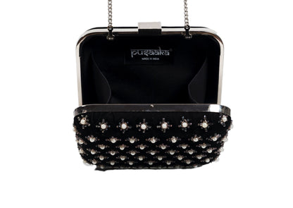 Inside view of black fabric evening clutch with metallic star beadwork, handcrafted premium Indian accessory.
