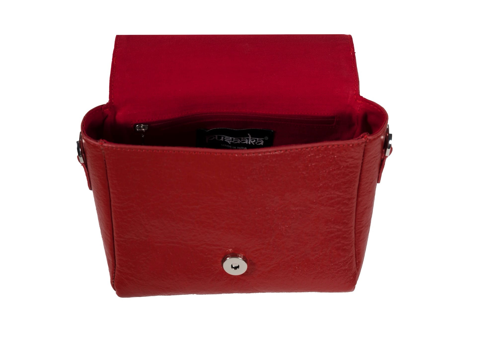 Inside view of vibrant red structured purse with delicate floral beadwork, premium Indian handcrafted accessory.