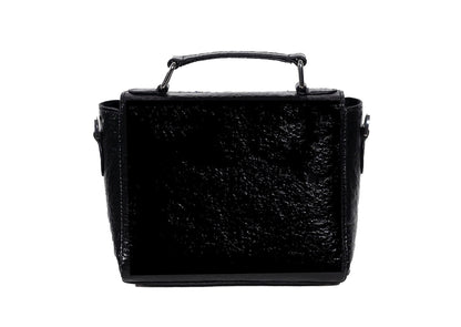 Rear view of geometric Czech glass bead patterns on a black structured bag, traditional Saurashtra handicraft.