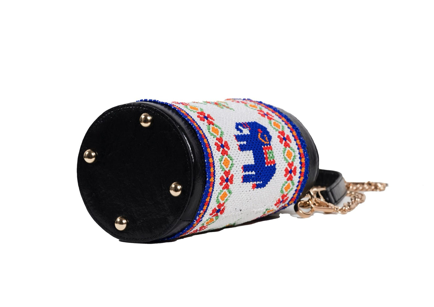 Bottom view of traditional Saurashtra elephant beadwork on a cylindrical bag with a vegan leather strap.