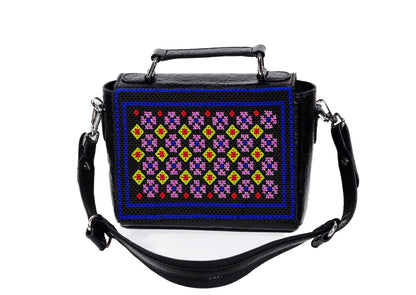 Intricate Czech glass geometric beadwork framed by cobalt blue, authentic Gujarati artisan bag.