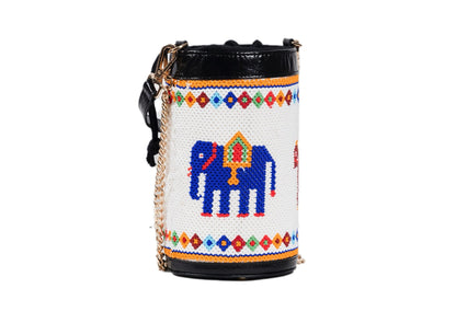 Elephant on cylindrical white beaded bag with red and blue palace motifs, Gujarati dal-moti handicraft.