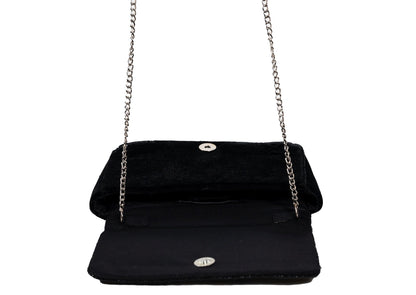 Inside view of black evening purse with silver wave pattern beadwork, premium Indian handcrafted accessory.
