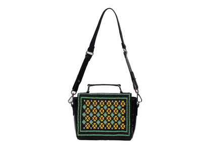 Geometric Czech glass bead patterns on a black structured bag showing strap length, traditional Saurashtra handicraft.