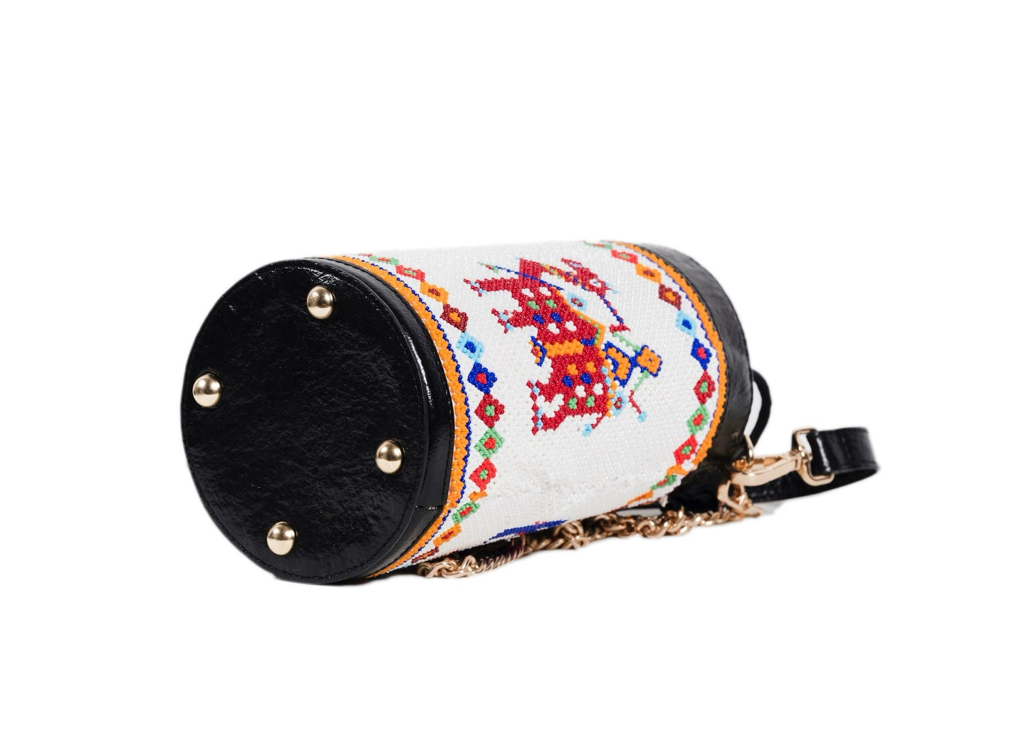 Bottom view of traditional Saurashtra architectural beadwork on a cylindrical bag, authentic Indian craft.