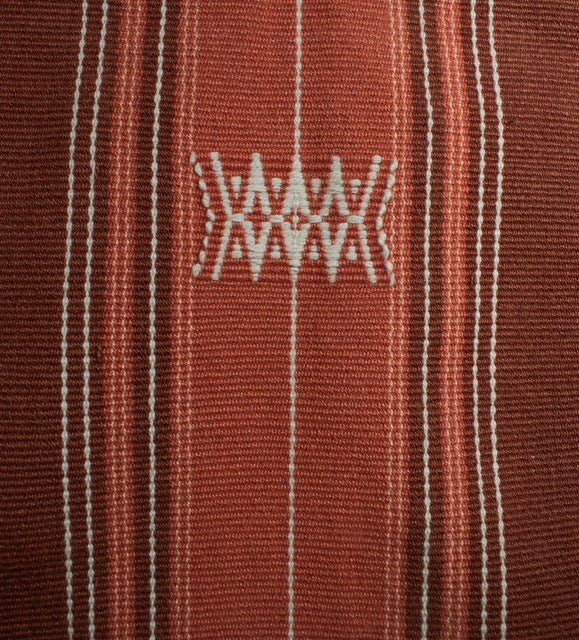 Detailed view of cozy handwoven cotton textures, luxury Indian artisanal home accessory.