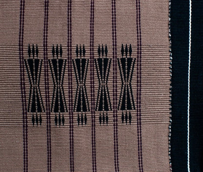 Detailed texture of brown and black cotton weaving, luxury Indian artisanal home decor.