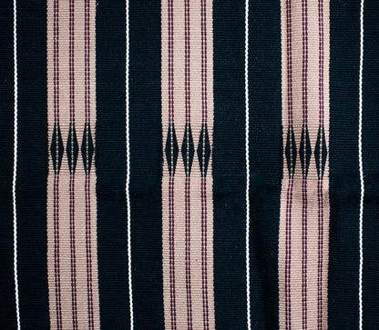 Detailed texture of brown and black cotton weaving, luxury Indian artisanal home decor.