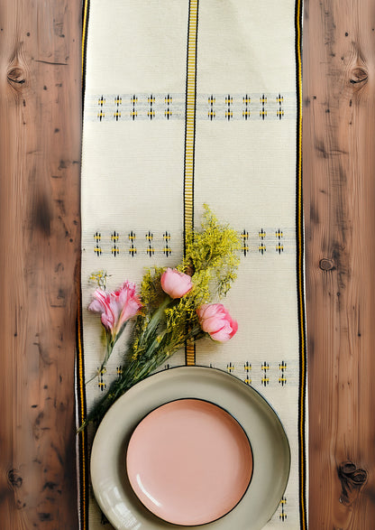 Traditional Nagaland woven runner styled with fresh flowers, authentic Indian dining decor.