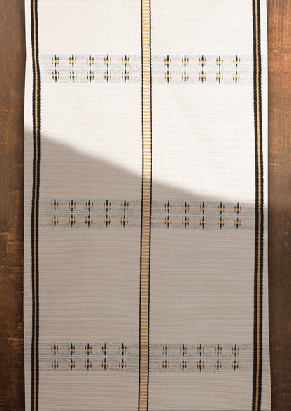 Handwoven cotton Konyak table runner with yellow accents, premium Naga loin loom textile.