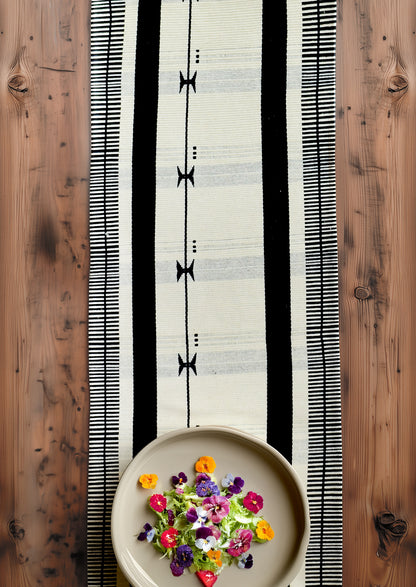 14x70 inch authentic Nagaland cotton table runner on a wooden surface, premium Indian dining decor.