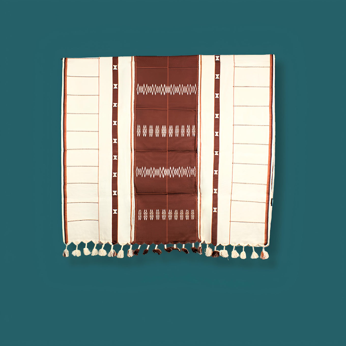 Cozy brown and cream cotton throw folded elegantly, premium Indian handcrafted home accessory.