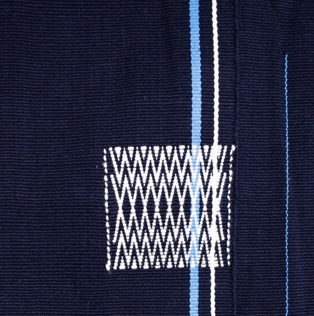 Detailed view of dark blue 100% cotton handwoven throw blanket, authentic Nagaland loin loom textile.