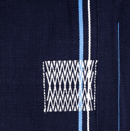 Detailed view of dark blue 100% cotton handwoven throw blanket, authentic Nagaland loin loom textile.