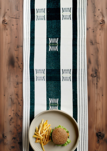 Intricate Nagaland woven cotton table runner on a dining table, premium Indian home decor.