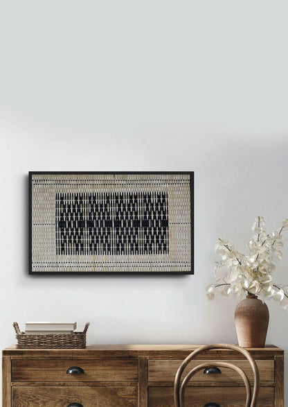 Handwoven bamboo textile inspired by tribal tattoos on a wooden console, authentic wall art.