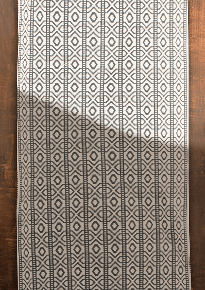 Black and white geometric pattern Yimchungru table runner, traditional Naga loin loom art.